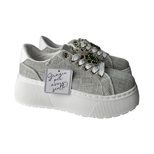 Sneaker verde salvia Ninì Paris con charm orsetto e para alta